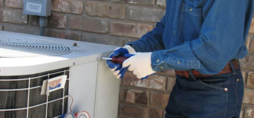 Man installing air conditioning system
